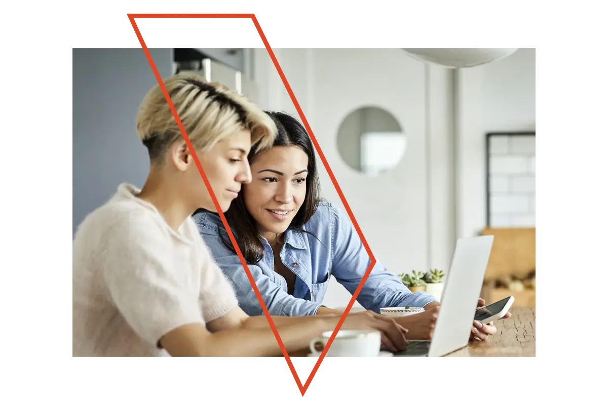 Two women on a laptop computer